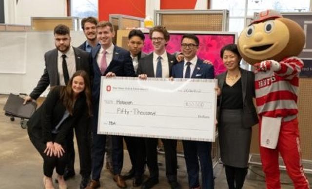 Image of full group of Holocron with Grace Wang and Brutus with check at Pitch Finale.