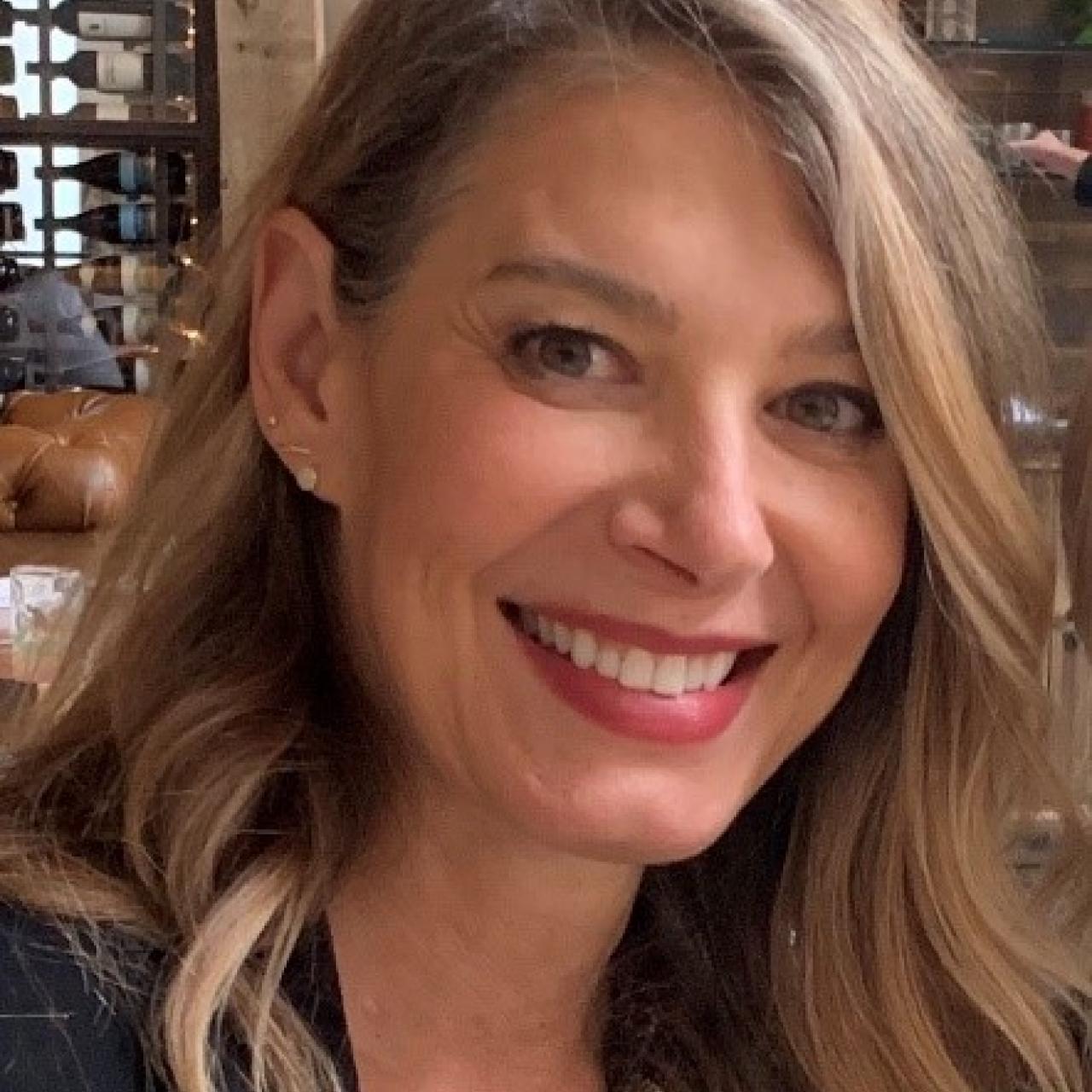 Head shot of Gretchen Goffe with plants in background