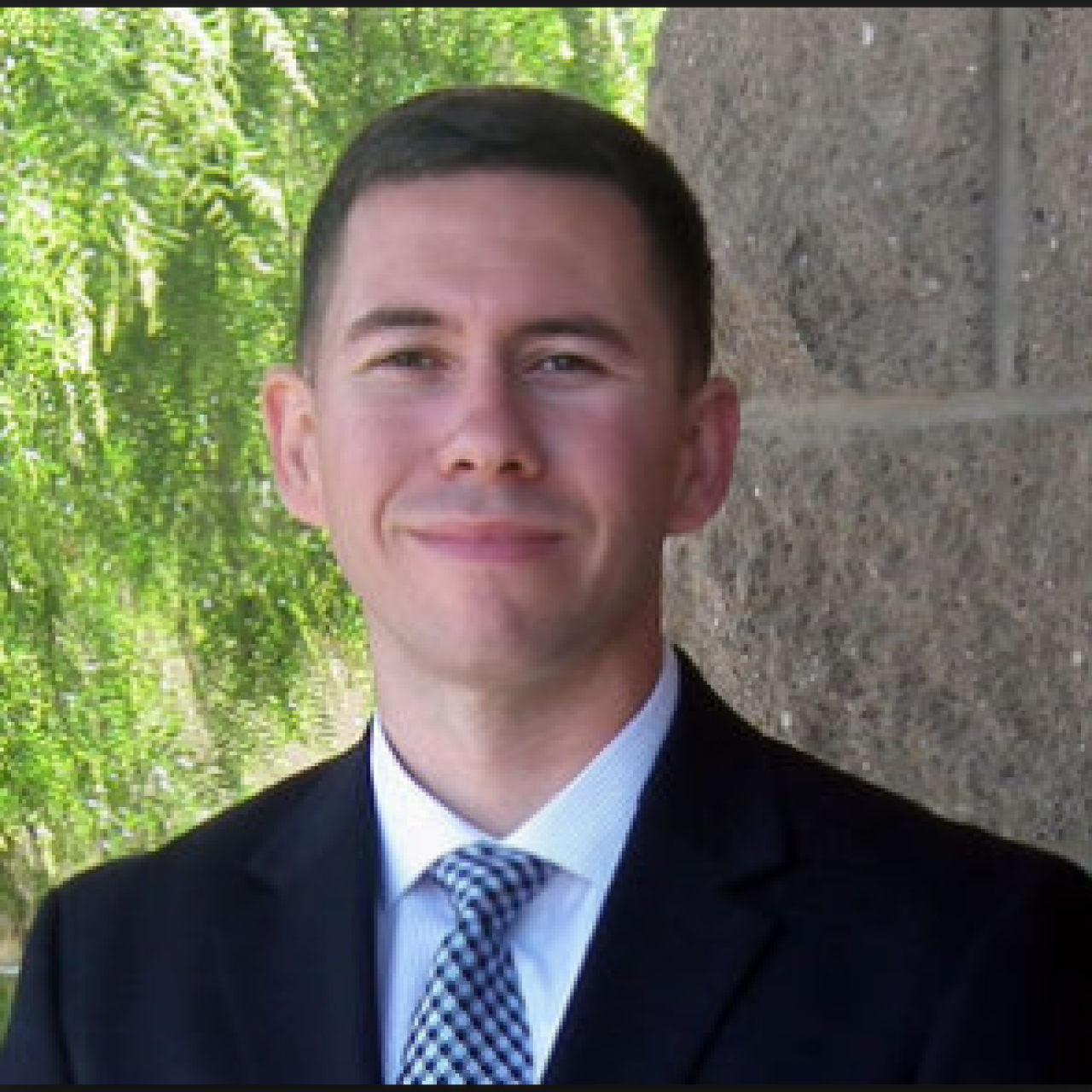 man in suit standing outside