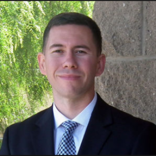 man in suit standing outside