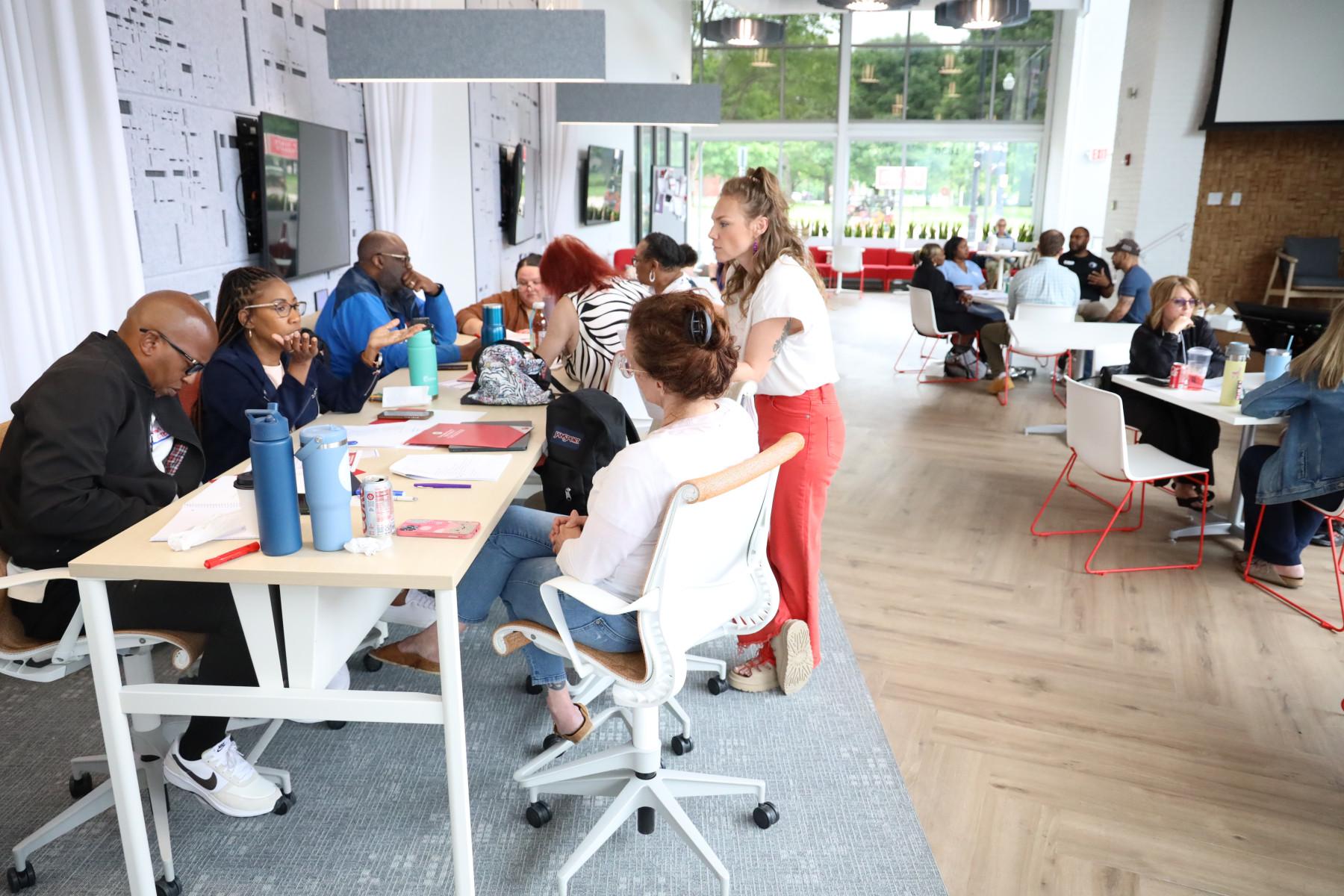Teachers work in groups at the Keenan Center